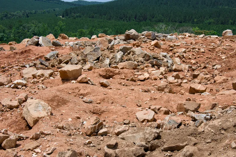 Ron Coleman Mining Top Of Open Dig Site With Many Rocks