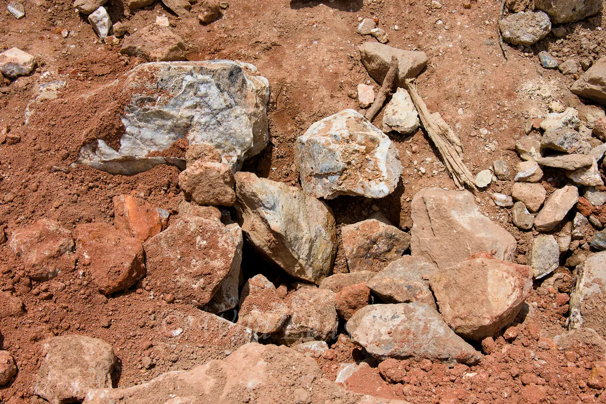 Ron Coleman Mining Close Up Of Large Dig Site Rocks With Quarts