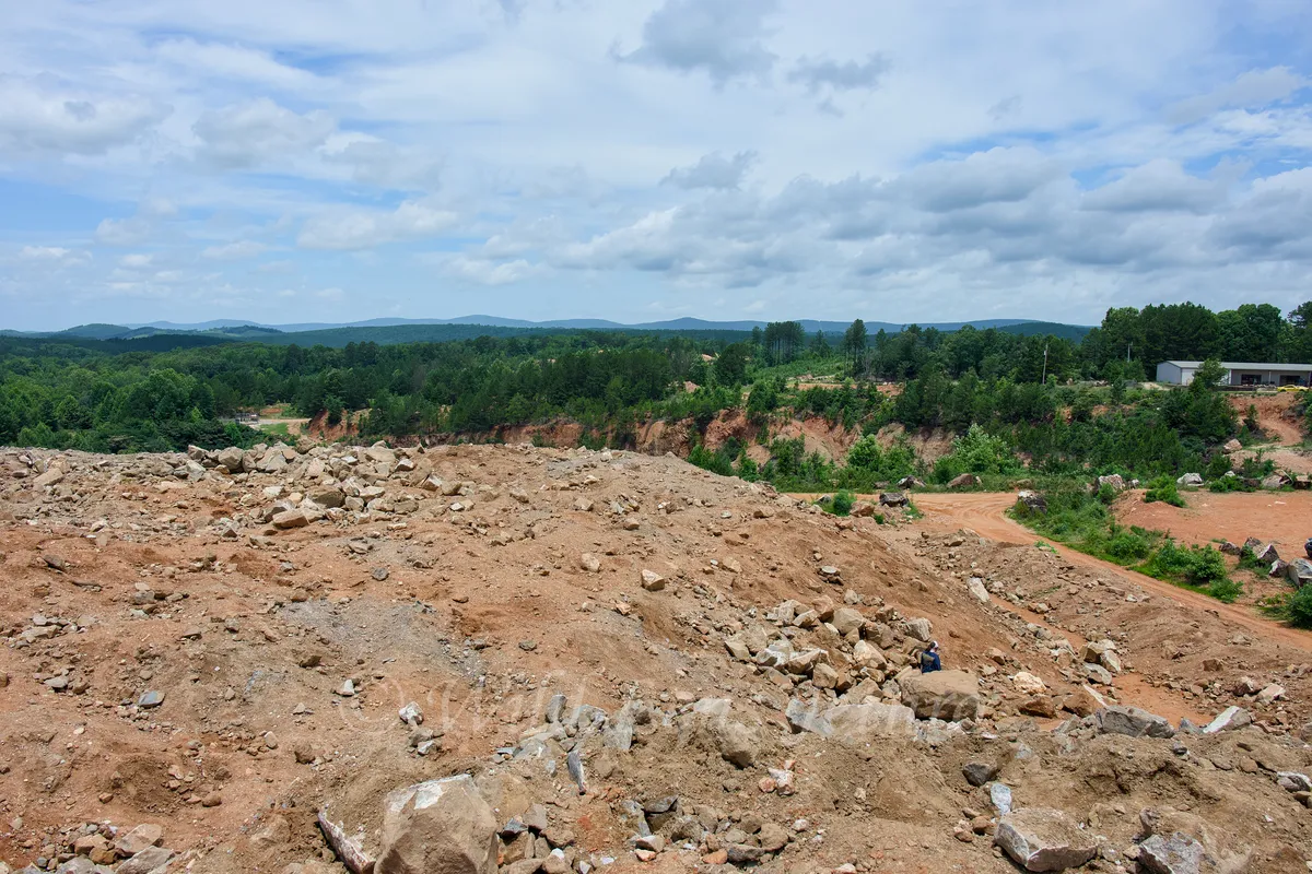 Ron Coleman Mining Dig Site Wide Angle With Trees In Background